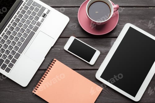 Preview: Open laptop with digital tablet and white smartphone close up top view