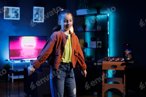 Preview: Kid in blue neon lit apartment doing viral dance while listening to popular hit song
