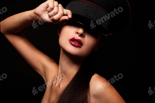 Preview: Portrait of beautiful young woman with red lips on black background
