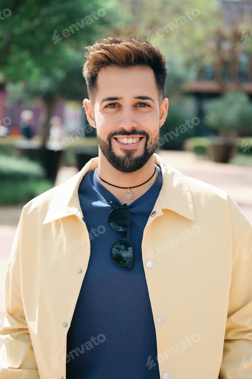 Preview: young bearded man smiling at the camera