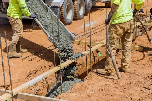 Preview: A process of pouring concrete trenches to serve as the foundation of a building