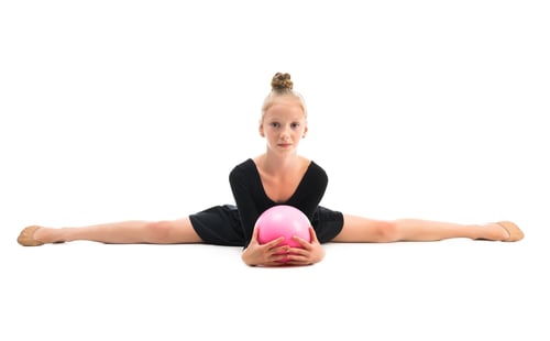 Preview: little gymnast doing exercise with ball