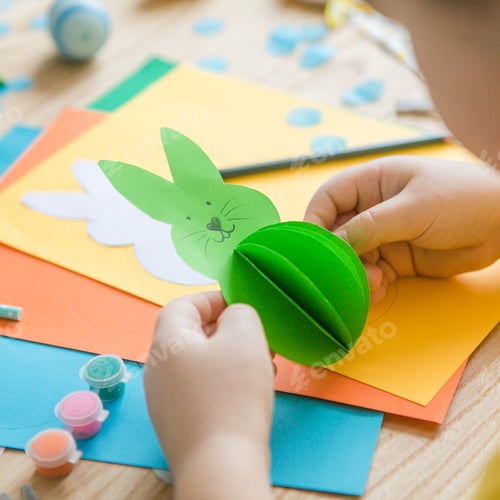 Preview: Little kid boy holding Bunny for Easter greetings card. Children's art project. DIY concept