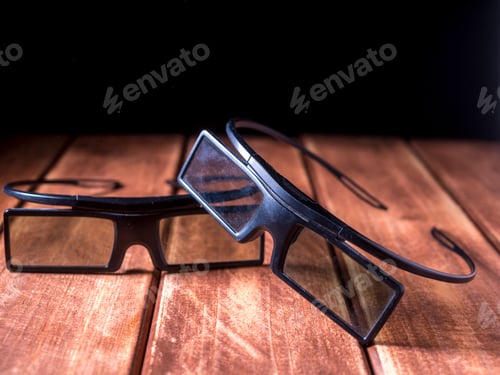 Preview: close up two 3d glasses on the wooden table