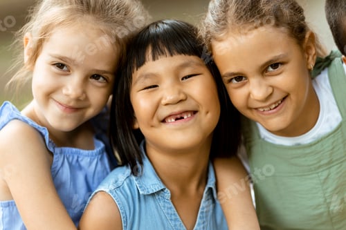 Preview: Group of asian and caucasian girls having fun in the park