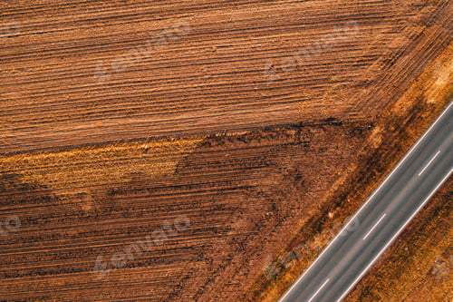 Preview: Aerial view of empty road through countryside