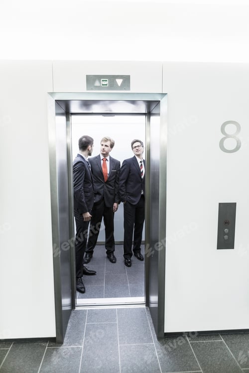 Preview: Businessmen standing in lift