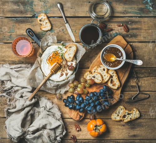 Preview: Cheese, fruit and wine set over rustic wooden background