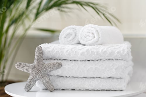 Preview: Rolled white towels in the bathroom