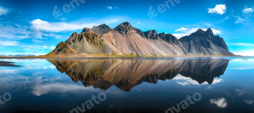 Preview: Splendid sunny day and gorgeous reflection of Vestrahorn mountaine on Stokksnes cape in Iceland.