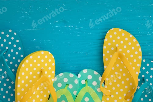 Preview: Beach flip-flops on blue wooden background
