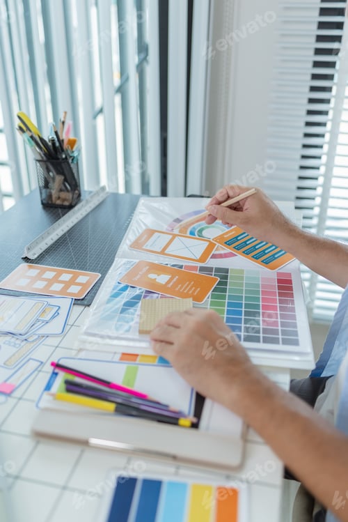 Preview: A focused designer is working on UX/UI design ideas