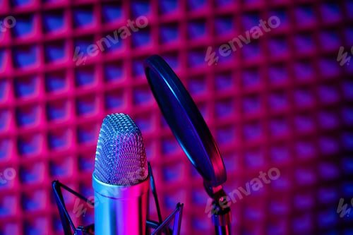 Preview: Professional studio microphone against acoustic foam panel background in neon light