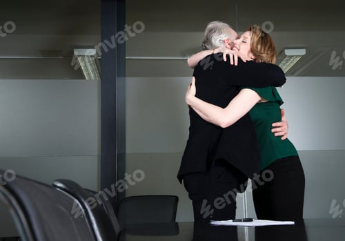 Preview: Businesspeople hugging