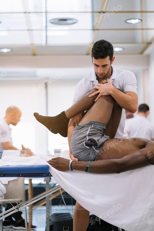 Preview: Man Receiving Physiotherapy Treatment in Clinic Setting