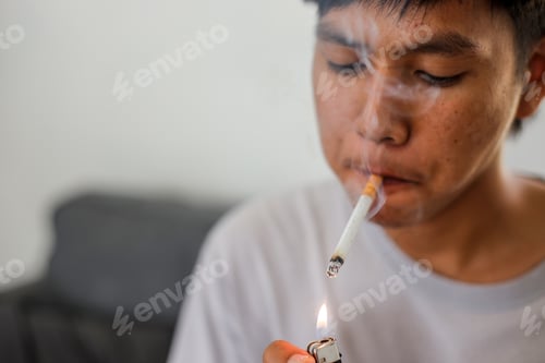 Preview: Asian man lit the cigarette with a lighter