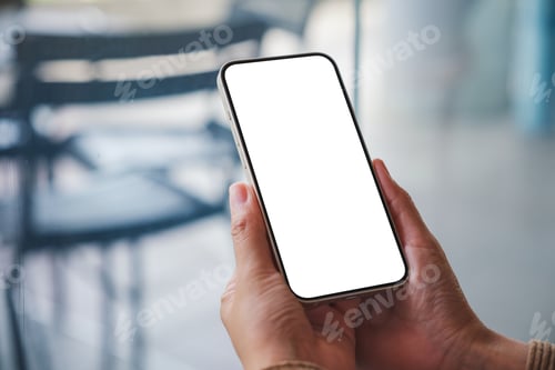 Preview: Mockup image of a woman holding mobile phone with blank desktop screen in cafe