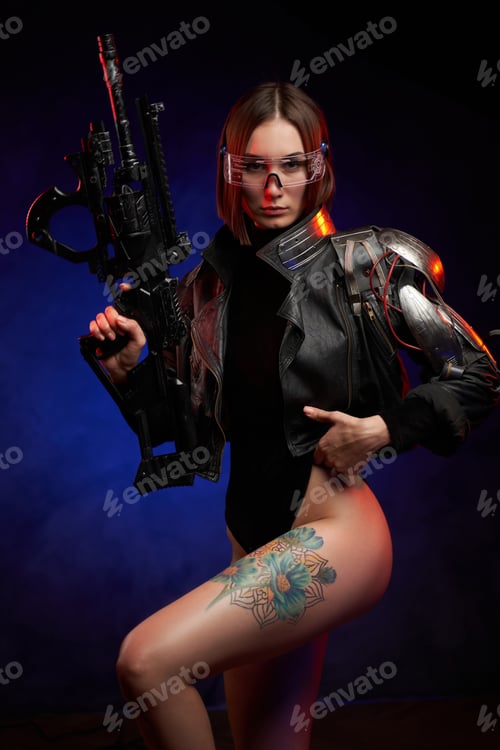 Preview: Sexy and slim woman with implant and rifle poses in dark background