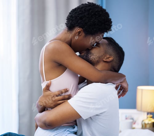 Preview: Keeping the fire burning in the bedroom. Shot of a young couple being intimate in bed at home.