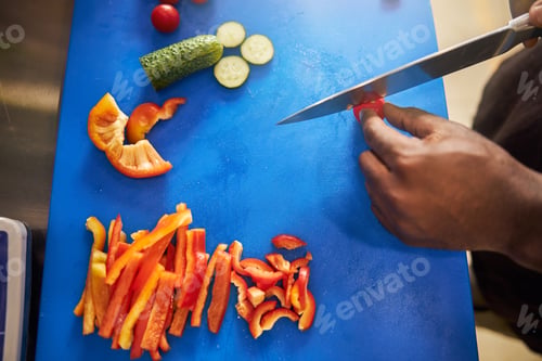Preview: Male preparing vegetable slices for cooking dish