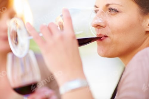 Preview: Woman drinking glass of red wine