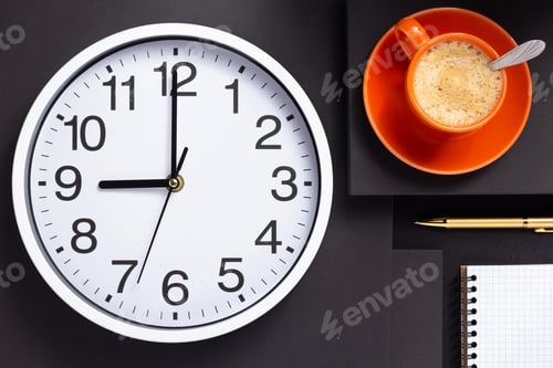 Preview: wall clock, cup of coffee and checked notebook
