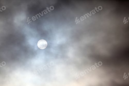 Preview: Afternoon Sun Shining Through Dark Clouds - Photograph Of An Afternoon Sun Peeking Through Dark