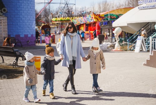 Vista previa: Young mother,mom with many small children walking together, having fun in amusement park. Family, ki