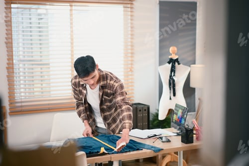 Preview: Fashion designer working in his home studio