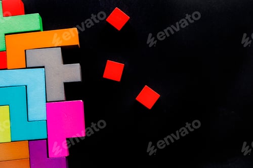 Preview: Different colorful shapes wooden blocks on black background, flat lay.