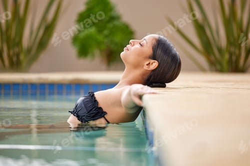 Preview: Serene Woman Relaxing in the Swimming Pool