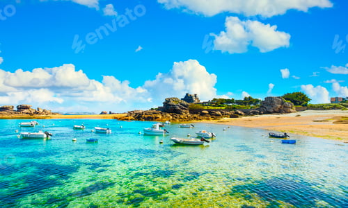 Preview: Tregastel, boats in beach bay. Pink granite coast, Brittany, France.