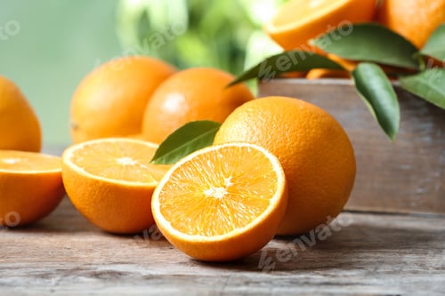 Preview: Ripe oranges on table against blurred background