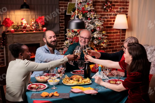 Preview: Diverse family clinking glasses with sparkling wine