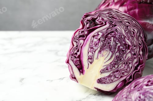Preview: Fresh red cabbages on white marble table, closeup. Space for text