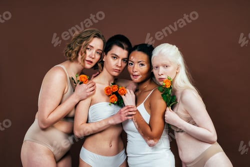Preview: multiethnic women with different kind of skin posing together in studio
