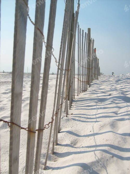 Preview: White beach with sand wind fence light and airy vacation getaway