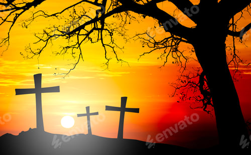 Preview: Silhouetted of cross on mountain with tree at sunset.