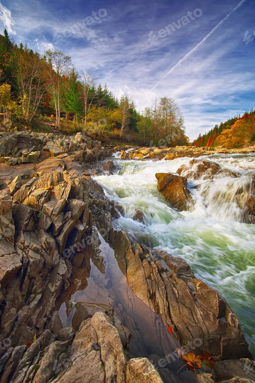 Preview: Mountain fast flowing river stream of water in the rocks