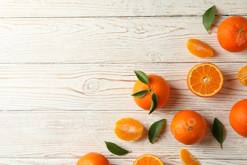 Preview: Ripe sweet mandarins on white wooden background, top view