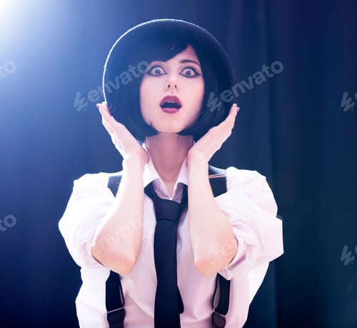Preview: Fashion brunette girl in hat. Studio shot with backlight.