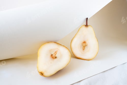 Preview: Ripe pears on white color tablecloth.