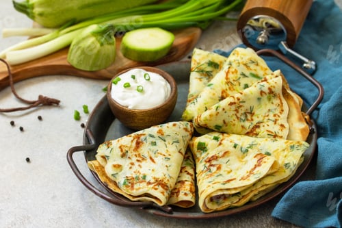 Preview: Zucchini pancakes with herbs served with sour cream