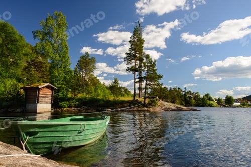 Preview: Green boat on a lake in a landscape in Norway