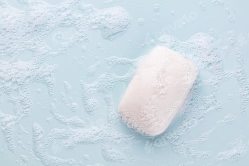 Preview: Soap bar and foam on white background, top view. Mockup for design