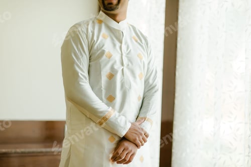 Preview: View of a male dressed in white oriental clothes