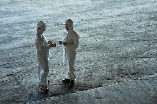Preview: People in Hazmat Suits at Factory