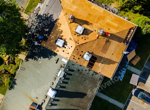 Preview: Roof shingles need with new shingles of an apartment building replacing a gray asphalt tile