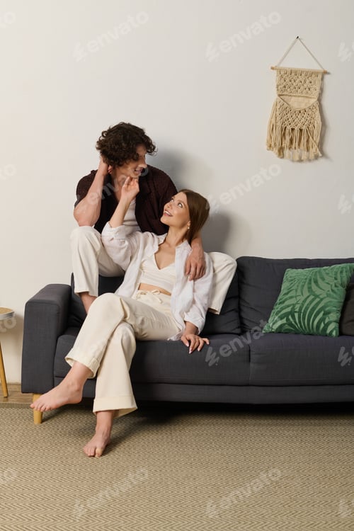 Preview: Young couple sharing joyful moments together in their cozy apartment
