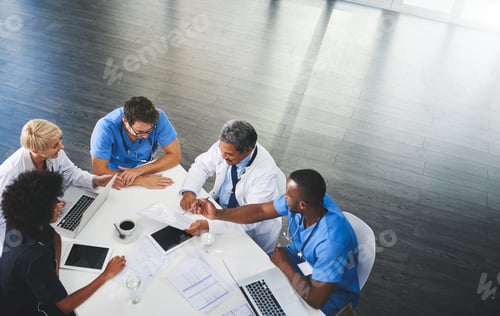 Preview: High angle shot of a team of doctors having a meeting in a hospital